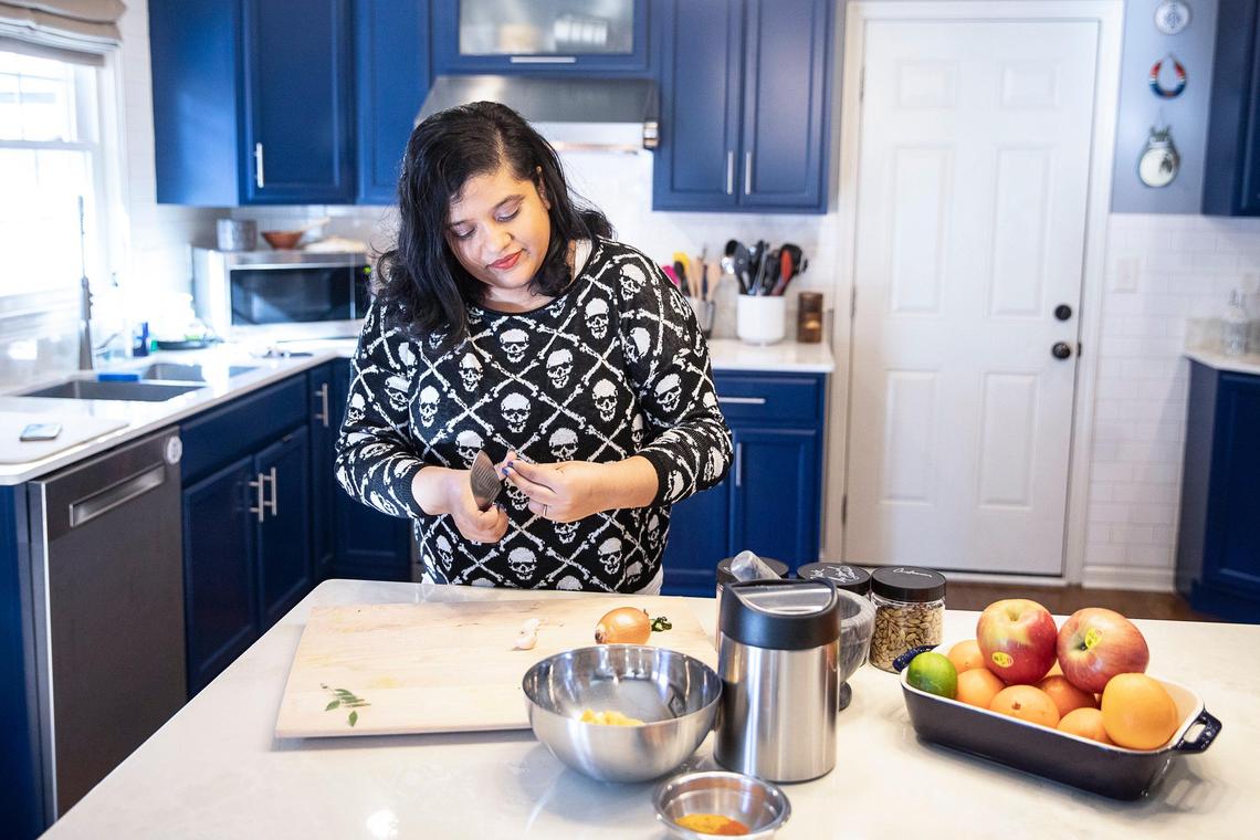 Samantha Fore peels ginger for her Sri-Lankan-meets-Southern cuisine, which has drawn raves nationally.