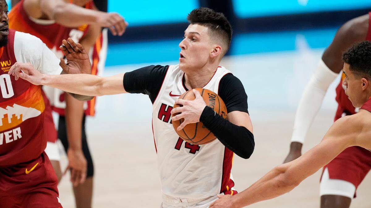 Miami Heat guard Tyler Herro (14) in the second half of an NBA basketball game Wednesday, April 14, 2021, in Denver. The Nuggets won 123-106. (AP Photo/David Zalubowski)