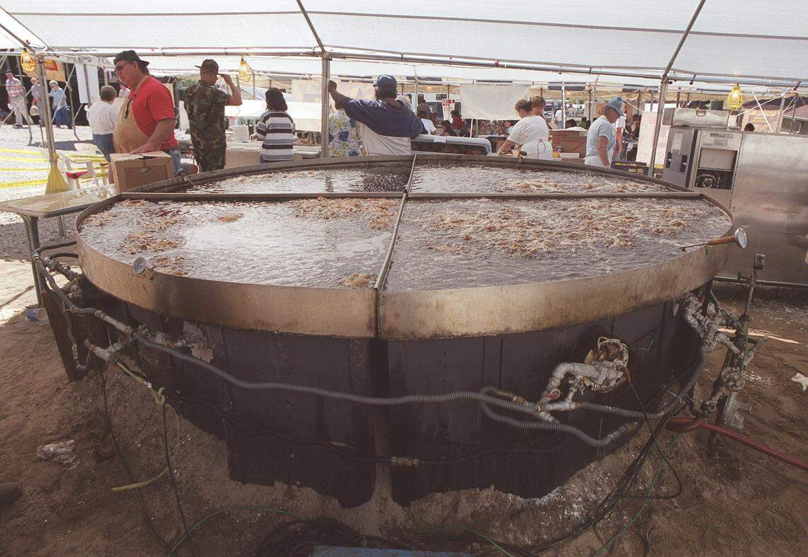 Chicken is deep fried in the “world’s largest skillet,” a tradition continued to this day, at the 10th annual  World Chicken Festival in London, Ky., Sept 24, 1999. It can cook 882 chicken quarters at a time.