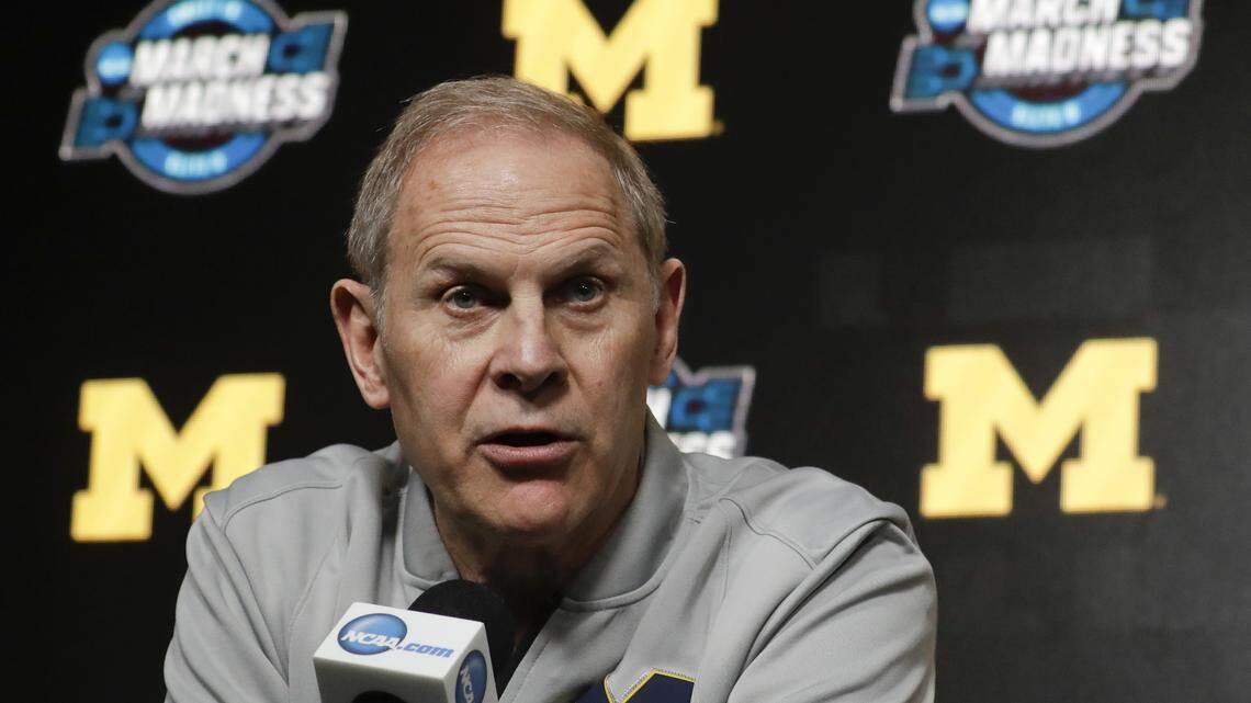 FILE - In this March 27, 2019 file photo Michigan head coach John Beilein speaks during a news conference at the NCAA college basketball tournament in Anaheim, Calif. Two people familiar with the decision say Beilein has agreed to become head coach of the Cleveland Cavaliers. The people spoke to The Associated Press on Monday, May 13, 2019 on condition of anonymity because the team had not announced the hire. ESPN, citing unidentified sources, said Beilein agreed to a five-year deal with the Cavaliers. (AP Photo/Chris Carlson, file)