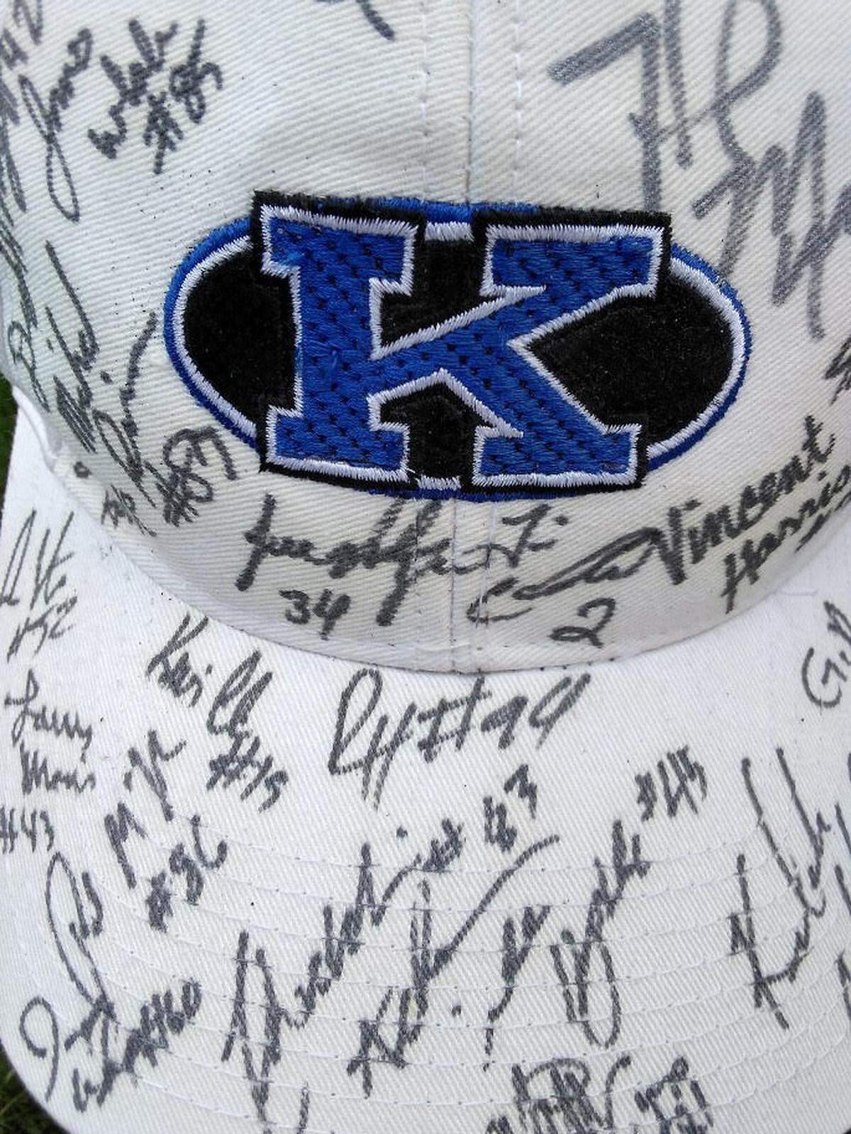 One of Leslie Hurst’s hats, signed by dozens of UK football players over the years.