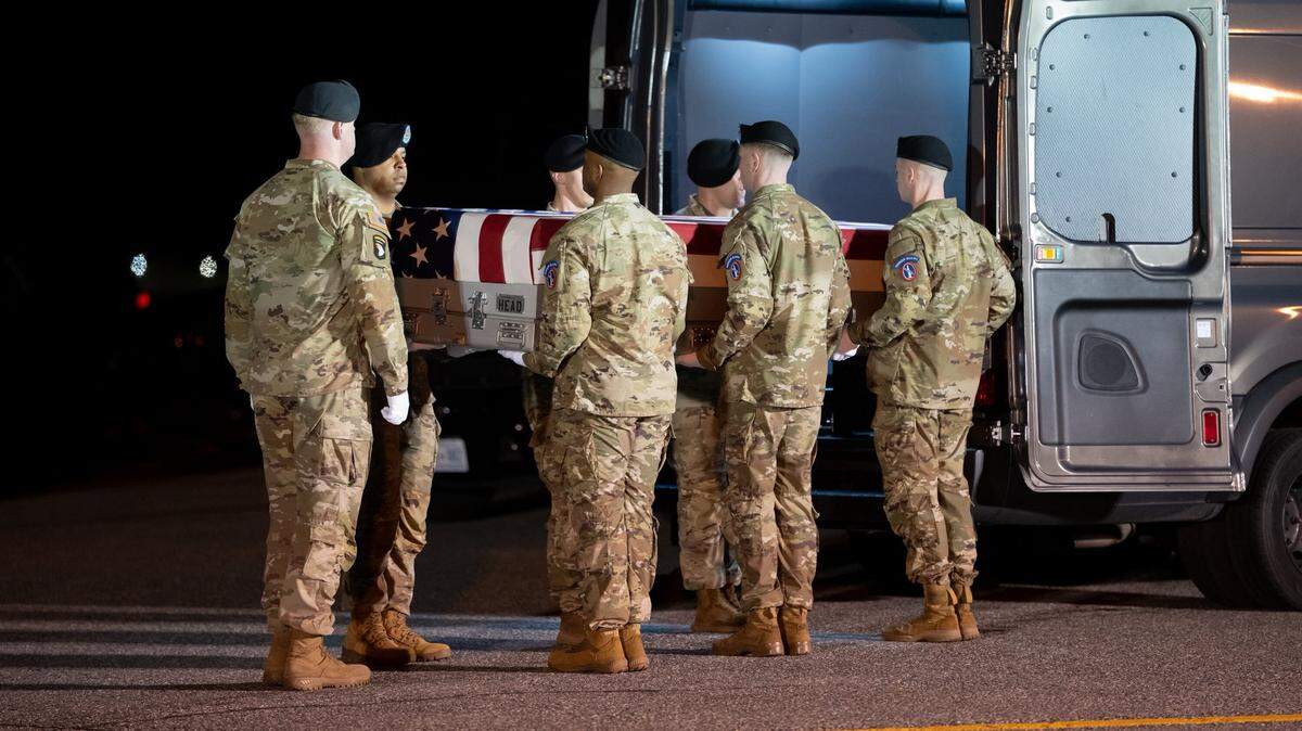 The remains of Sgt. Benjamin Pennington, of Glendale, Ky., are placed in a van during a dignified transfer ceremony at Dover Air Force Base in Dover, Del.