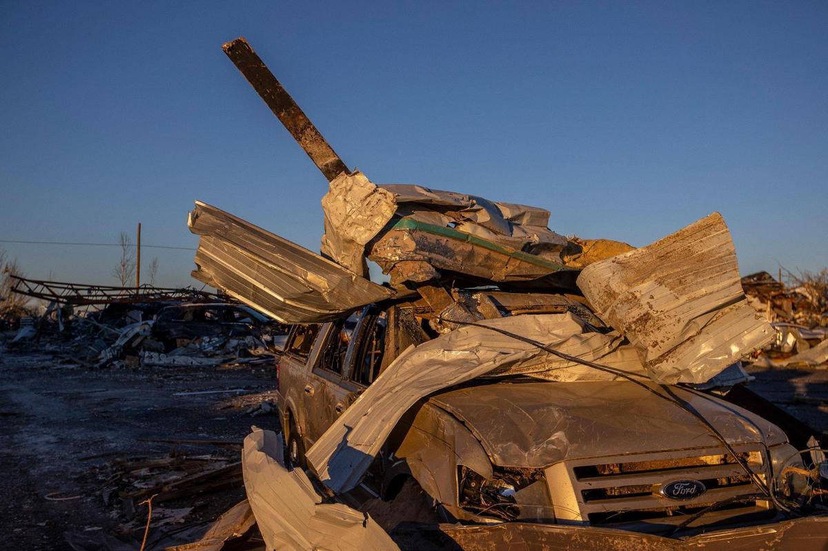 The building where Luis ÔChiliÕ Pardo runs a small used car lot was damaged from a tornado that struck Mayfield, Ky., on Friday night, and every car in his lot has its windows broken or took an even worse beating.
