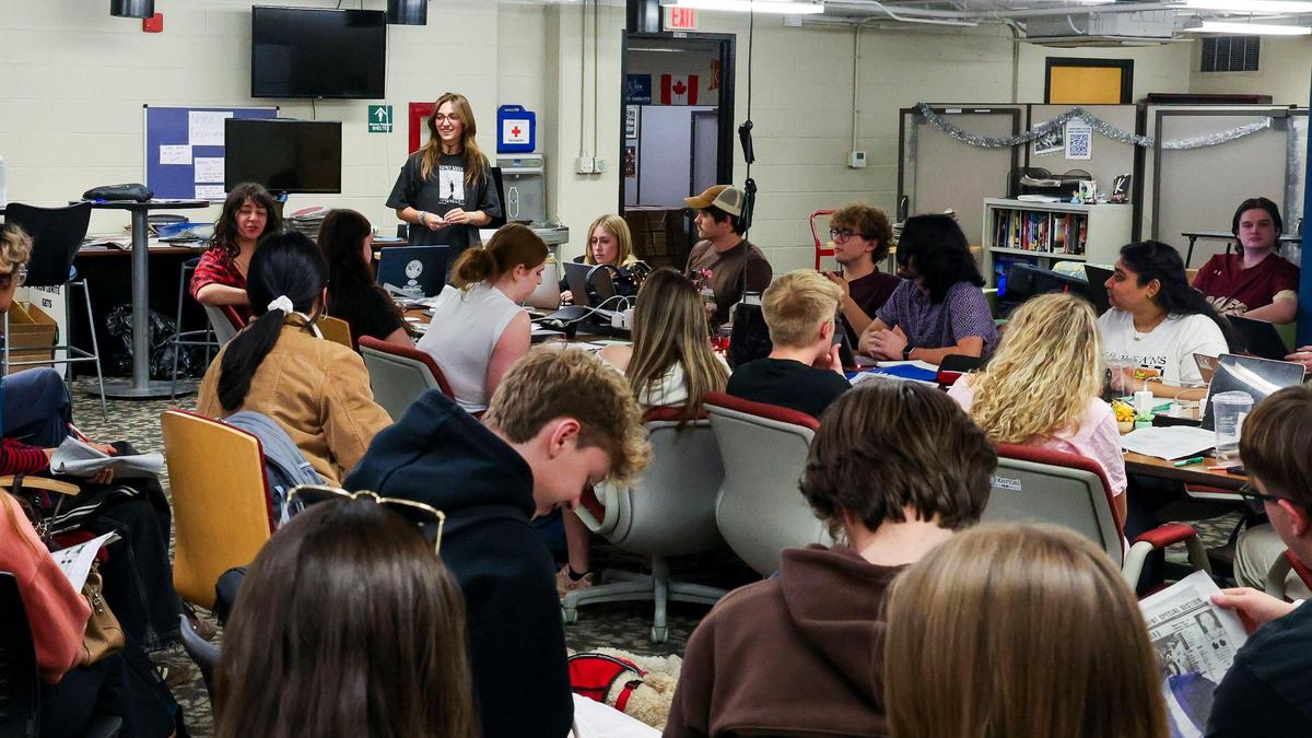 Abbey Cutrer, Editor-in-Chief of the Kentucky Kernel, standing in the background, leads a staff meeting, Monday, March 10, 2025 in the offices of the independent student newspaper of the University of Kentucky in Lexington, Ky.