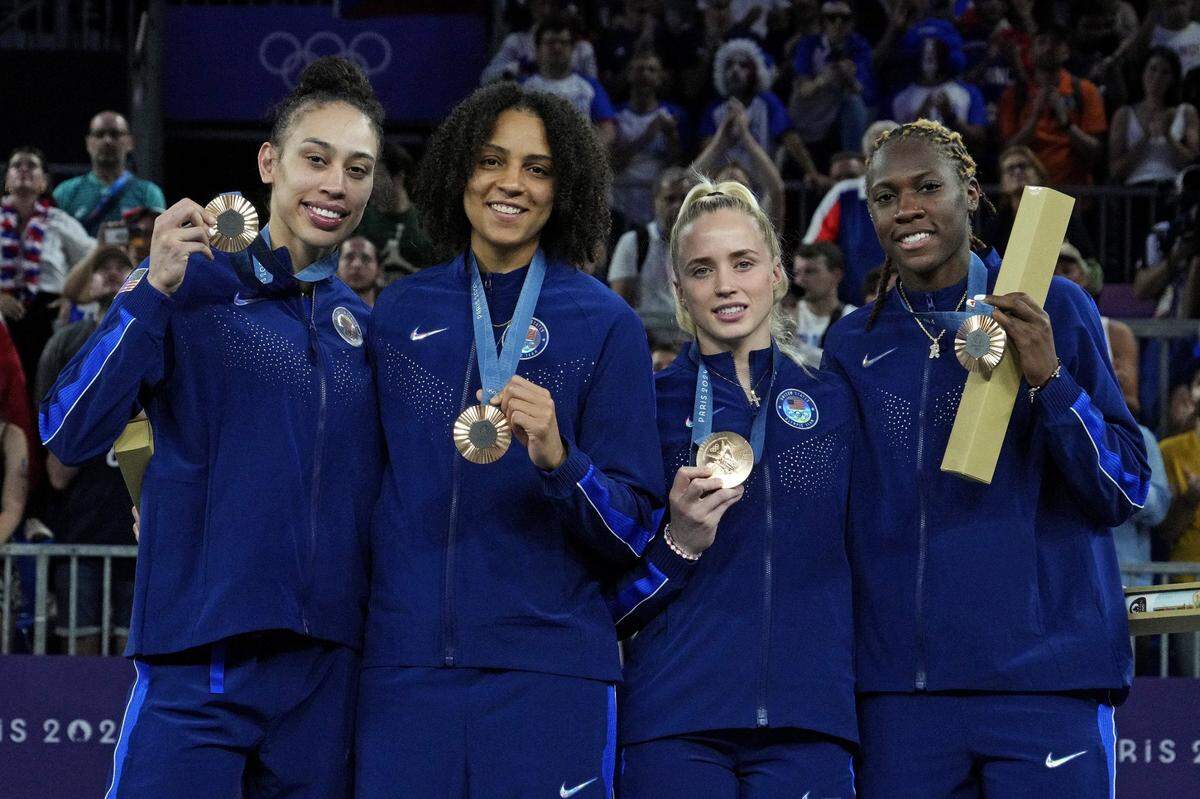 Aug 5, 2024; Paris, France; The United States pose with the bronze medal in women's 3x3 basketball during the Paris 2024 Olympic Summer Games at La Concorde 1. Mandatory Credit: Michael Madrid-USA TODAY Sports