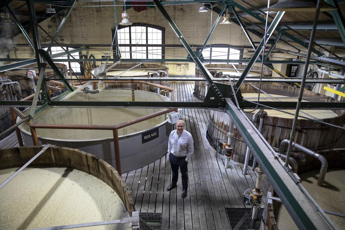 Brent Elliott, master distiller at Four Roses Distillery, stands amid vats of fermenting mash at the Lawrenceburg distillery in 2019. 