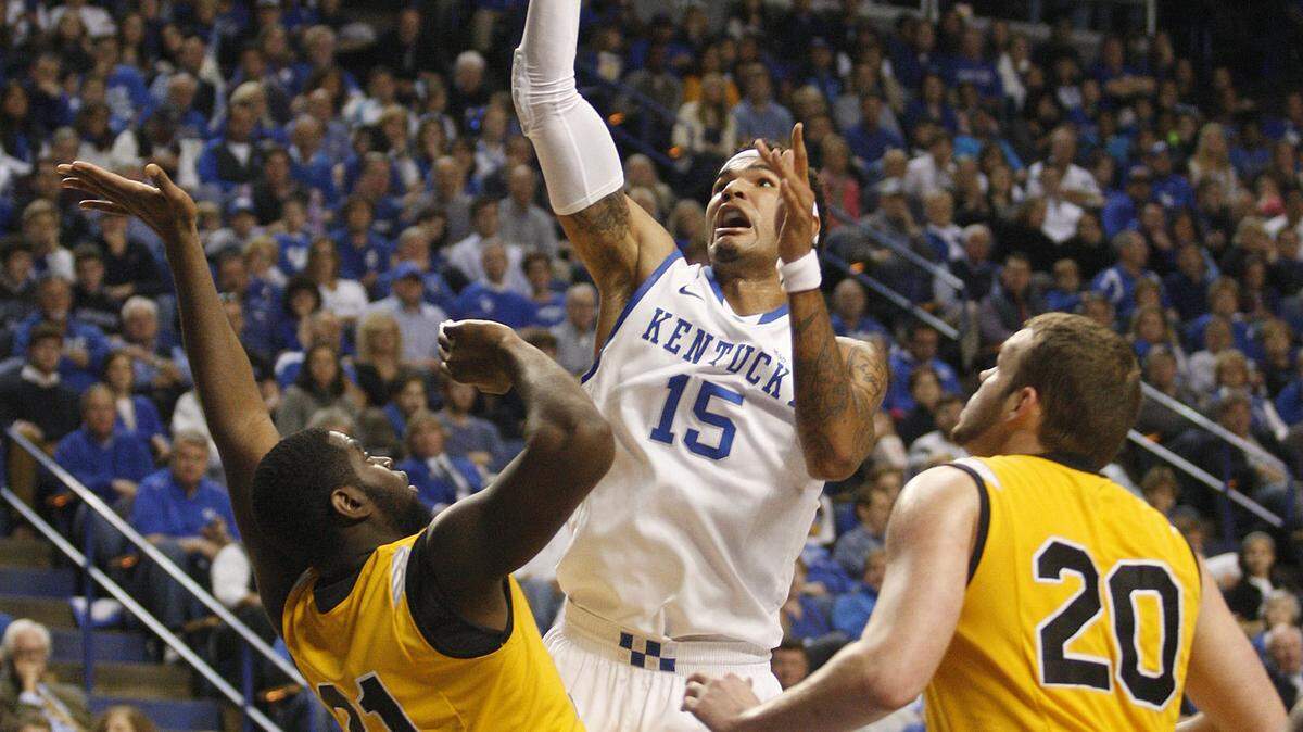 Kentucky's Willie Cauley-Stein shot over Northern Kentucky's Jalen Billups in the first half Sunday at Rupp Arena. He had seven points and 11 rebounds in just 20 minutes of action.    
