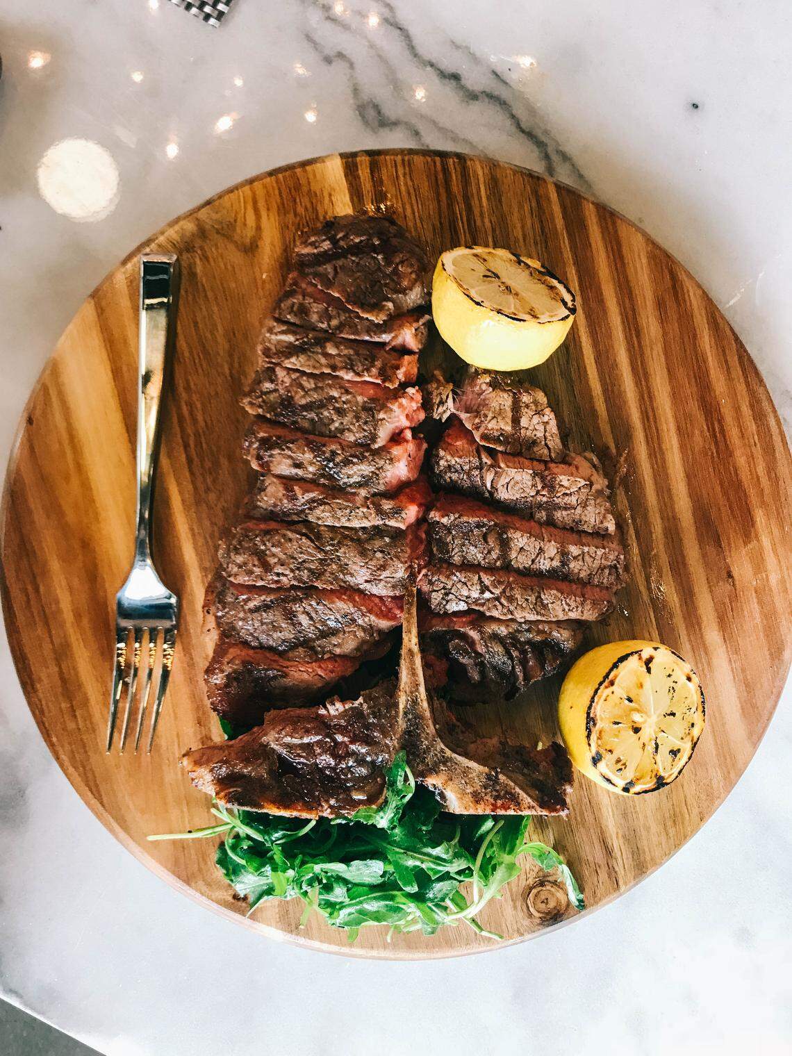 The dry-aged porterhouse for two comes with a bourbon sauce at Bardstown Bourbon Company.