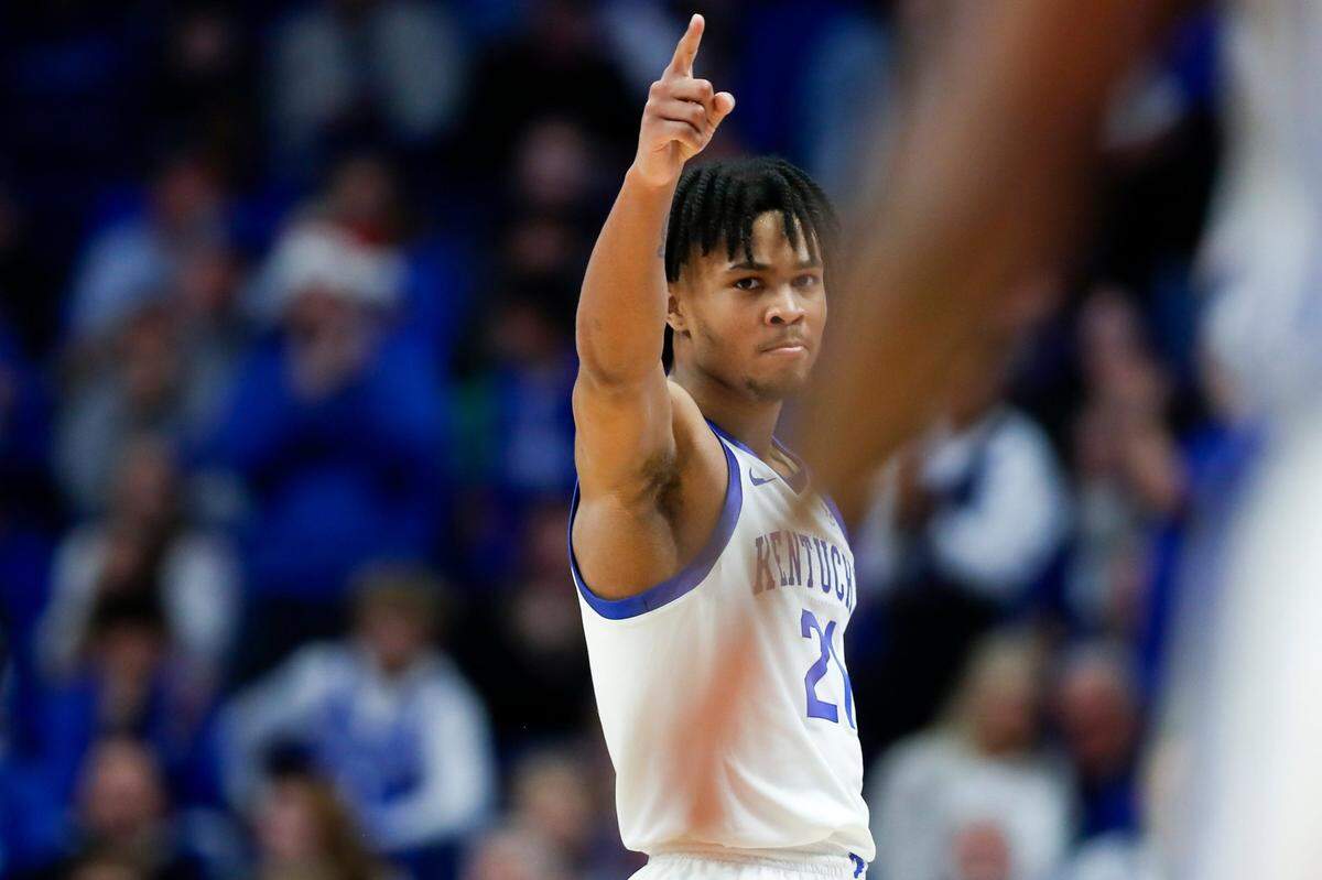Kentucky guard D.J. Wagner celebrates scoring off an assist from teammate Rob Dillingham during Friday’s game against Marshall in Rupp Arena. Wagner had 28 points and five assists in the Wildcats’ victory.