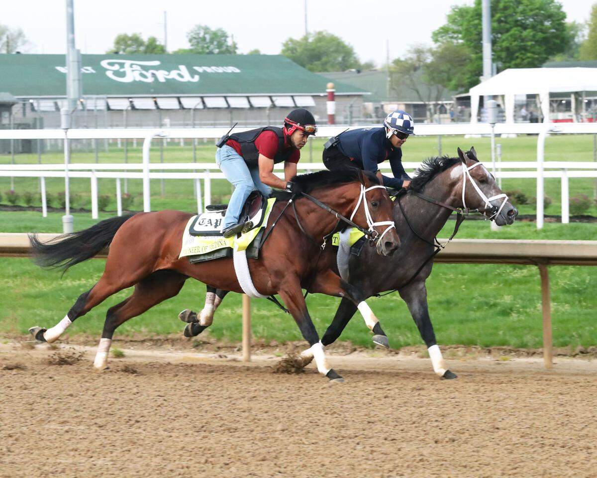 Pioneer of Medina, on the outside, and Charge It worked out ahead of the Kentucky Derby on Saturday.