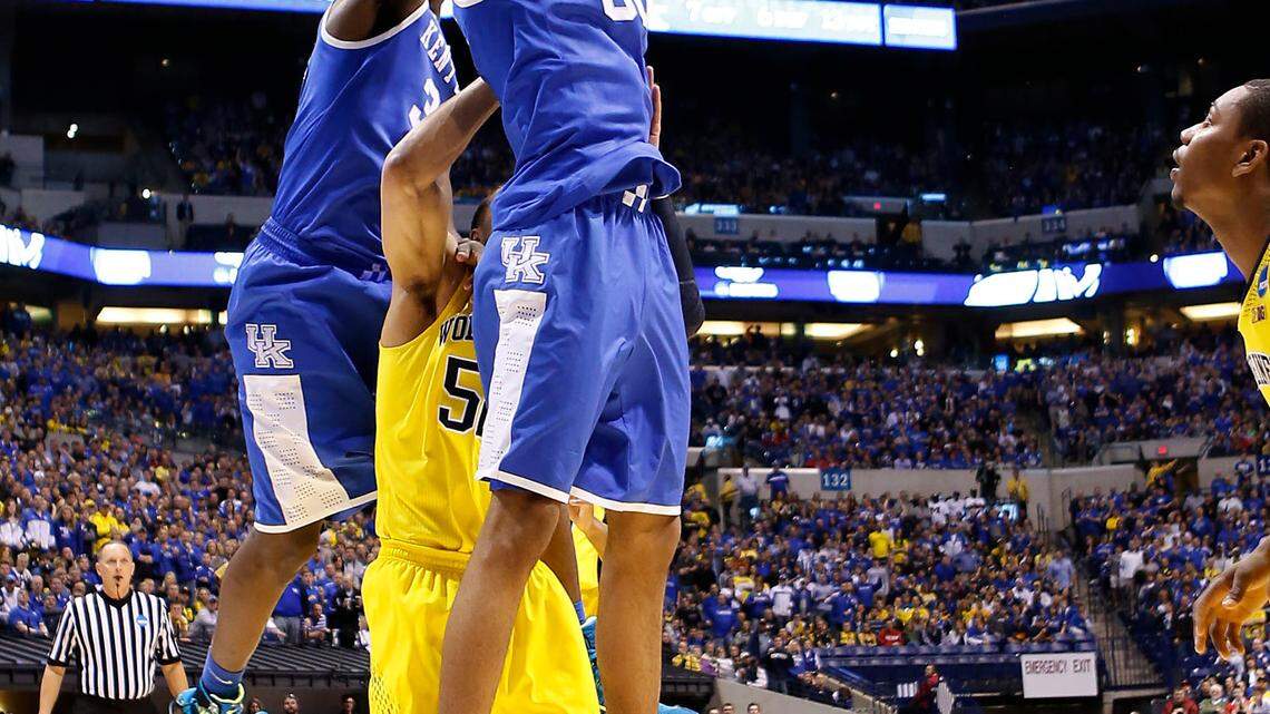 Kentucky Wildcats forward Marcus Lee (00) dunked as the University of Kentucky played the University of Michigan in Lucas Oil Stadium in Indianapolis, In., Sunday, March 30, 2014. This is first half NCAA Midwest Regional finals action. Photo by Charles Bertram | Staff 