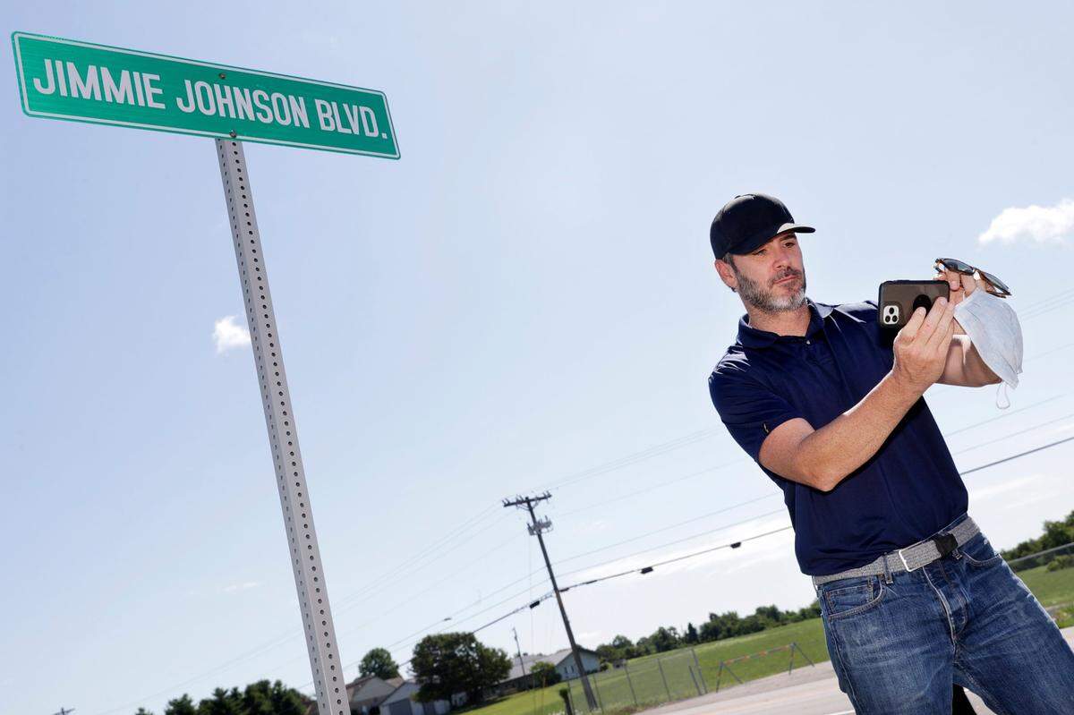 Seven-time NASCAR Cup Series champion Jimmie Johnson took a selfie in front of the street sign bearing his name that was unveiled outside Kentucky Speedway on Sunday.