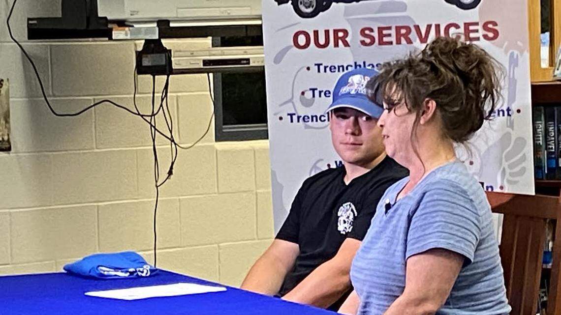 Jacob Bradley, left, a 2022 graduate at Montgomery County High School, and his mother Angie Bradley appeared in mid-May at a letter of intent signing ceremony for a Lexington plumbing company where he starts full-time May 31.