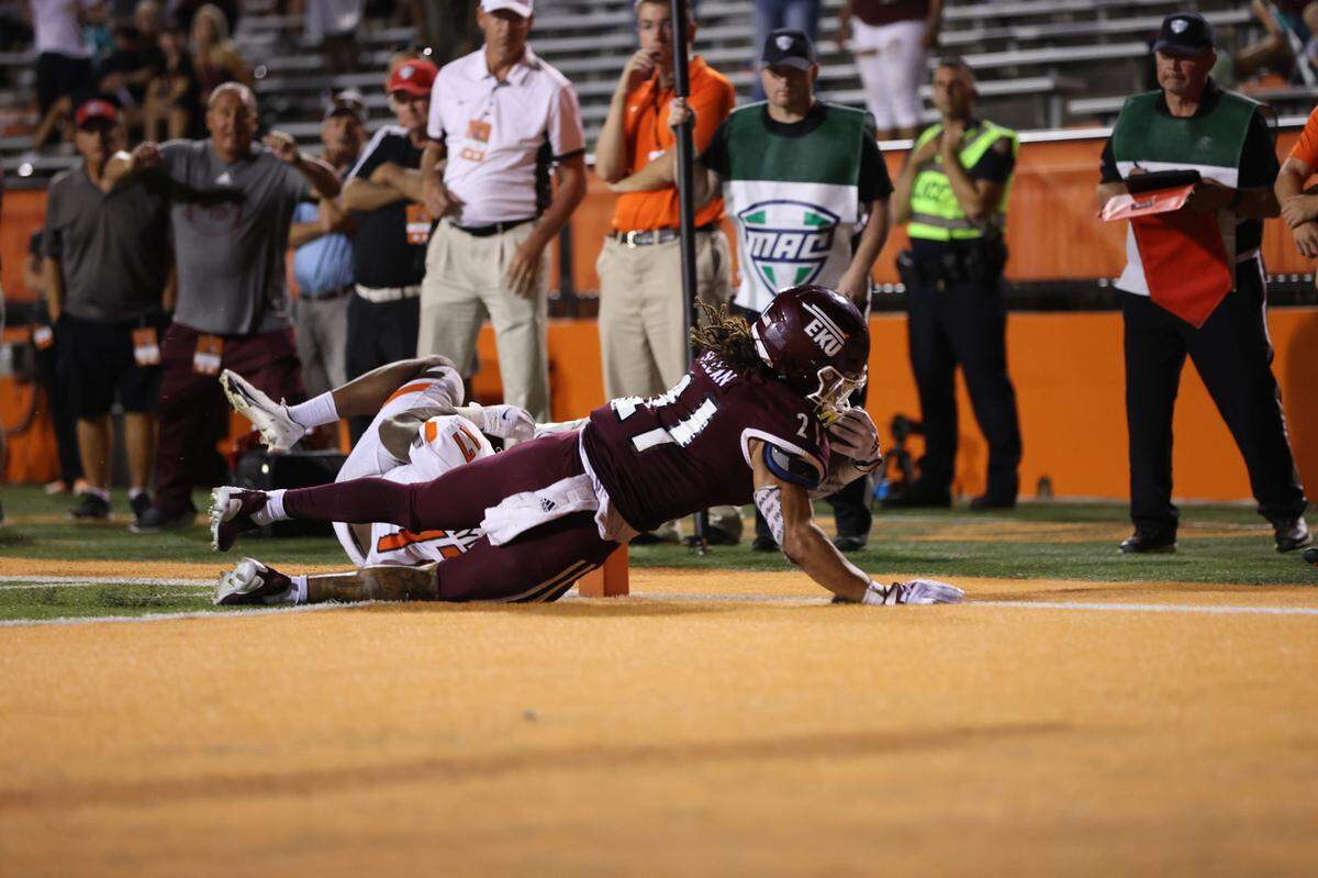 Eastern Kentucky sophomore running back Braedon Sloan dives inside the pylon to give the Colonels a seven-overtime win at Bowling Green on Saturday night. It was EKU’s first win over an FBS opponent since 2014.