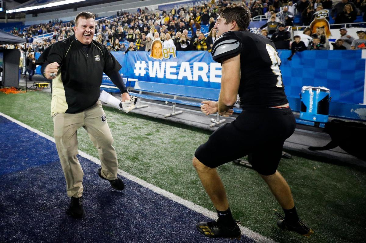 Boyle County’s Justin Haddix and Jagger Gillis celebrate after the Class 4A state finals against Johnson Central at Kroger Field on Dec. 3.