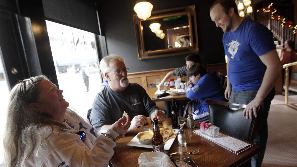 Regular customers Pam Patenaude and Jerry Patenaude shared a laugh with server Brandon Smalley at deSha's on Saturday when the restaurant closed after 28 years. The couple from Louisville had a ritual of having a pre-game meal at DeSha's before every Kentucky home game.