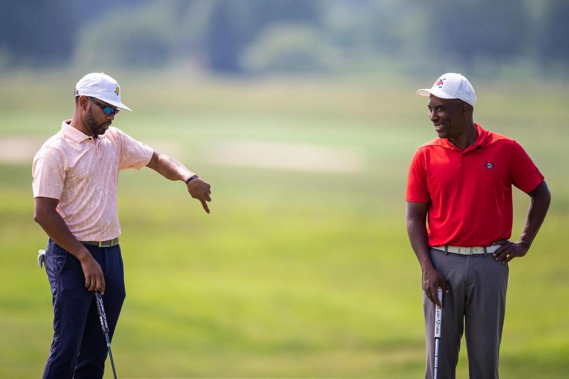 Doug Smith, left, and Kevin Hall, were paired together on day two of the APGA Tour Louisville event. Smith has known Hall, who’s deaf, going back to their youth, and is one of few golfers on the tour who can communicate with Hall via sign language. Hall, a Cincinnati native who starred for Ohio State, has played on the PGA Tour this season.