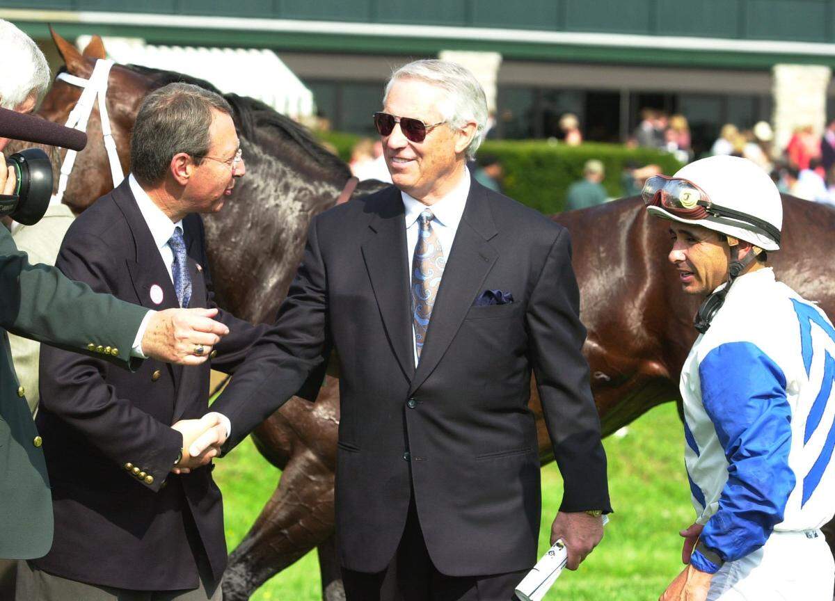 Legendary horse racing trainer D. Wayne Lukas (center) died Saturday at the age of 89 in Louisville.