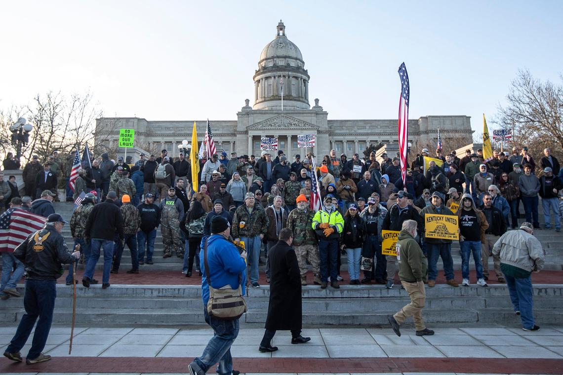 Participants of a rally in support of the Second Amendment pose for a photo in front of the State Capitol in Frankfort, Ky., Tuesday, Jan. 7, 2020.