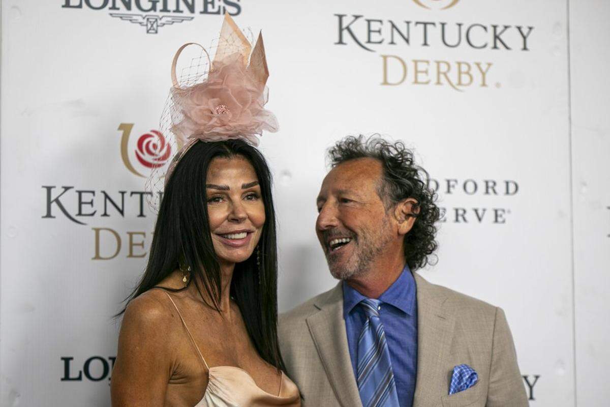Rob Angel and Susan Booth of Pictionary walk the red carpet at Churchill Downs in Louisville, Ky., Saturday, May 7, 2022.