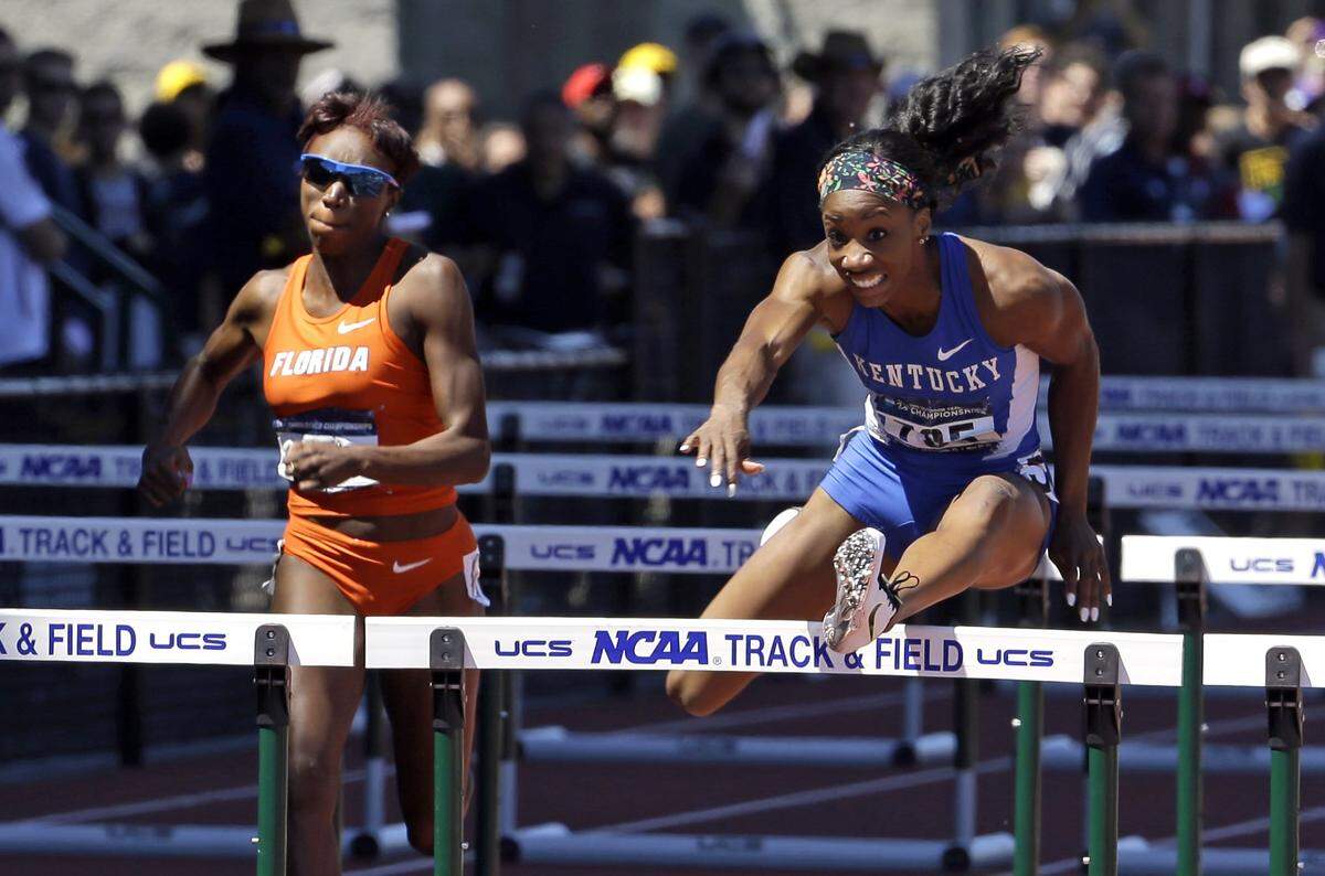 At Kentucky, Keni Harrison (right) helped the Wildcats earn a second-place team finish at the 2015 NCAA Outdoors Track and Field National Championship Meet.
