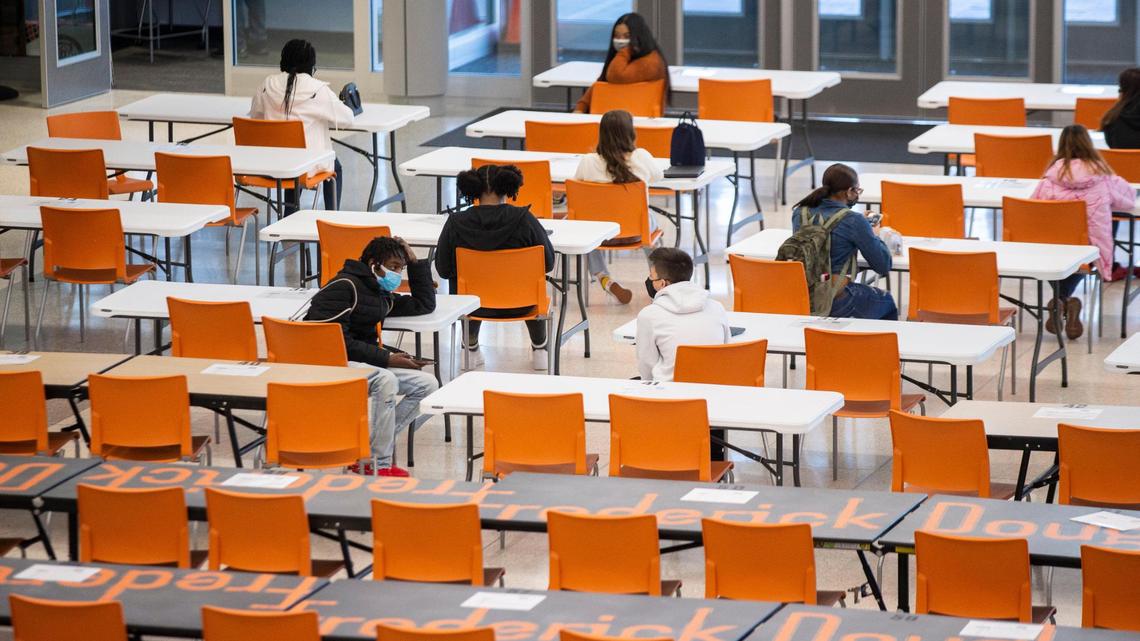 Students walk through the cafeteria as they return to in-person learning at Frederick Douglass High School in Lexington, Ky, Monday, March 8, 2021. ‘We will learn a lot from today. We’ve got a really good plan and we’ve been very thorough,” Executive Principal Lester Diaz said.