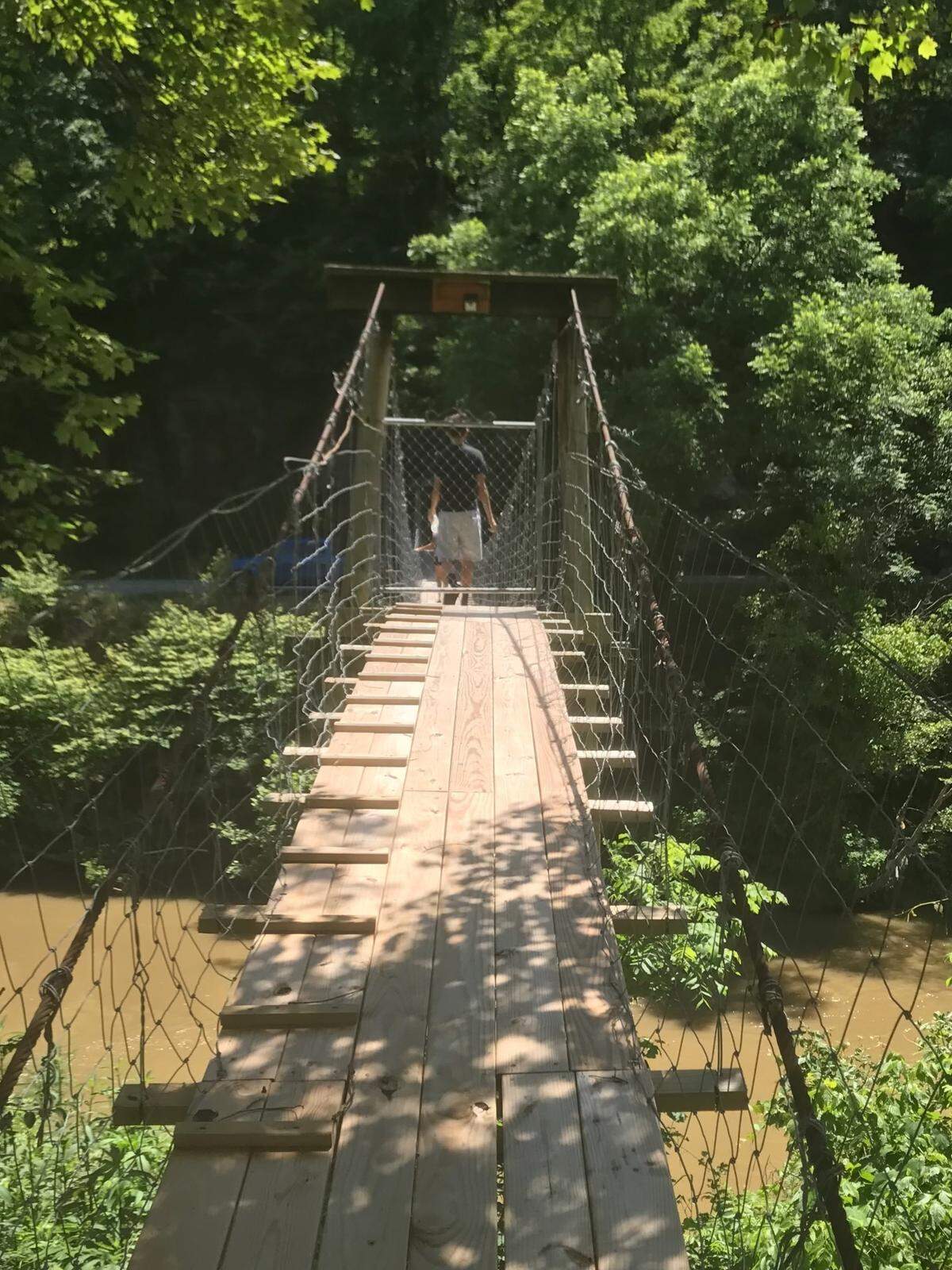 Gilla Miller’s family said the 83-year-old was fond of the swinging bridge that connected her home to the nearby highway. In Thursday’s floods, it was destroyed. This photo shows what it looked like before the flood.
