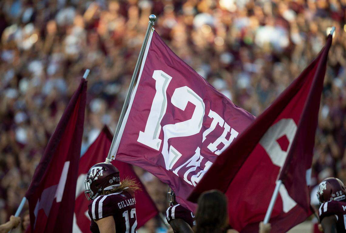Texas A&M fullback Cullen Gillaspia (12) carried the 12th Man flag as the Aggies took the field before playing ULM at Kyle Field on Sept. 15.