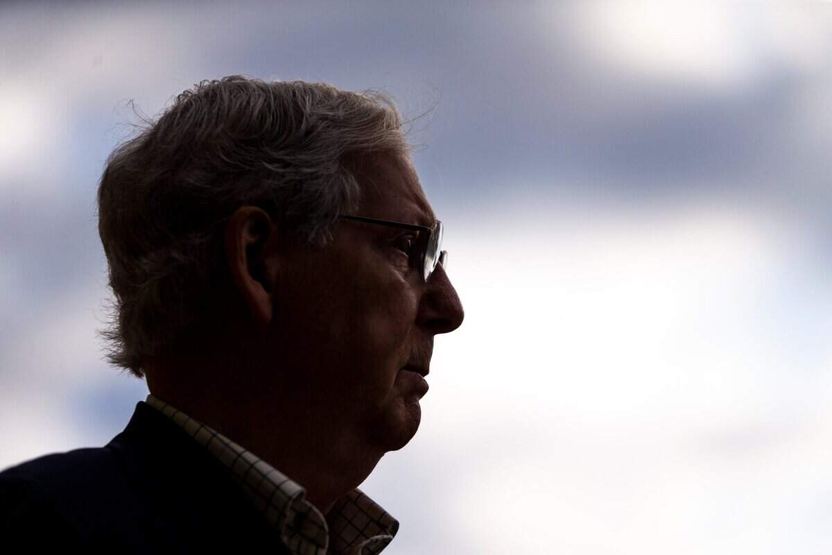 Senate Majority Leader Mitch McConnell speaks with reporters after casting his ballot during early voting at the Kentucky Exposition Center in Louisville, Ky., Thursday, October 15, 2020.