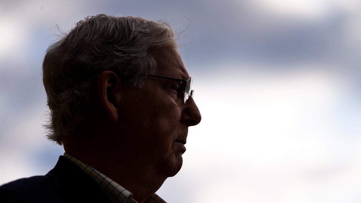 Senate Majority Leader Mitch McConnell speaks with reporters after casting his ballot during early voting at the Kentucky Exposition Center in Louisville, Ky., Thursday, October 15, 2020.