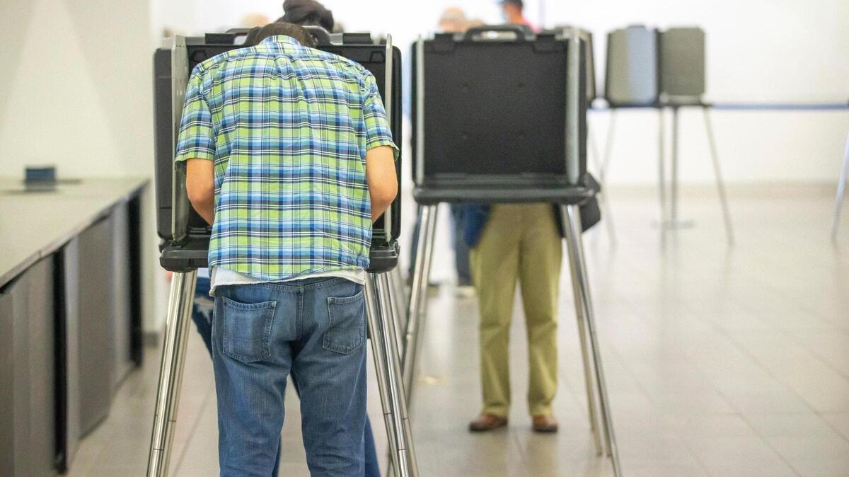 Voters cast their ballots during early voting at Kroger Field in Lexington, Ky., on Thursday, May 12, 2022.