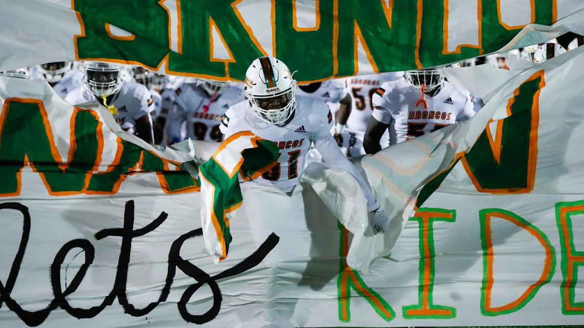 Tashawn Benford (31) of Frederick Douglass runs onto the field before the Broncos faced Boyle County this season. Douglass takes a spotless 11-0 record into the second round of the playoffs.