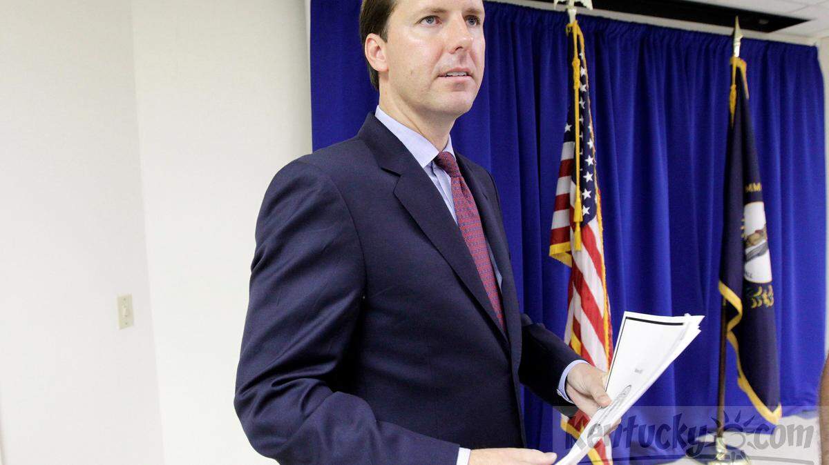 State auditor Adam Edelen held a copy of a press release with details of an audit after a news conference regarding the report on the Kentucky Division of Emergency Management. at his office in Frankfort, Ky., on Aug. 6, 2013.  Kentucky Emergency Management may have misspent millions in recent years, some of it on alcohol, entertainment and door prizes at conferences. Photo by Pablo Alcala | Staff 