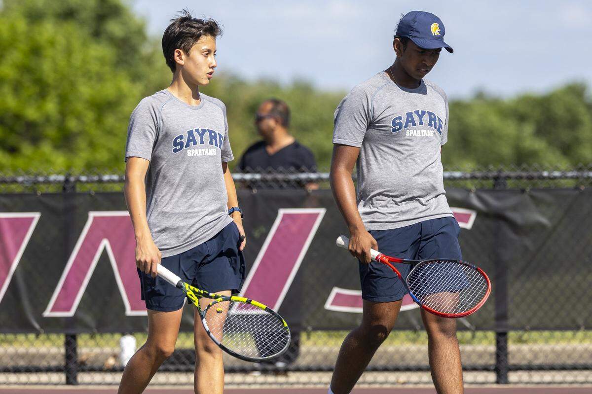 Sayre's Jack Mooney, left, and Dhaarick Vinod walk on the court during the 11th Region boys and girls tennis championships in singles and doubles competition at Eastern Kentucky University Tennis Courts in Richmond, Kentucky, on May 13, 2026.