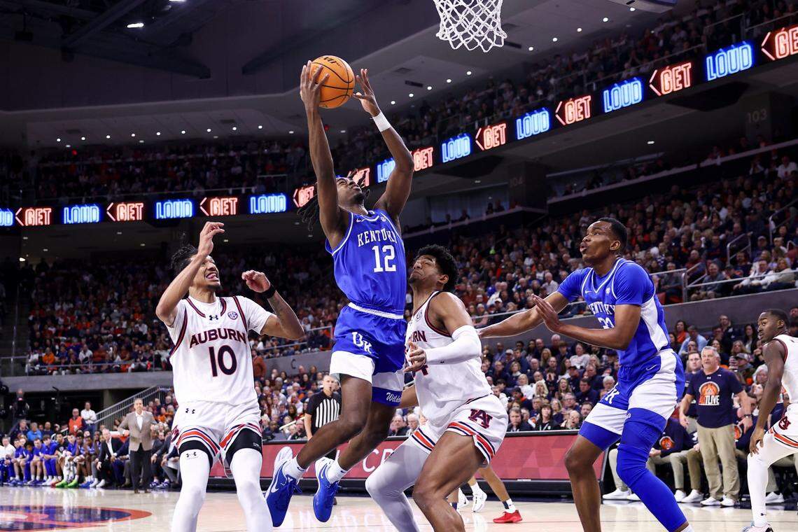 Kentucky’s Antonio Reeves (12) drives against Auburn’s Dylan Cardwell (44) during Saturday’s game.