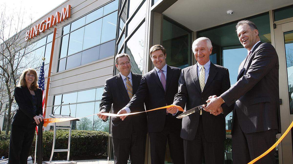 Bob Quick, second from left, president of Commerce Lexington, along with Attorney General Jack Conway, Gov. Steve Beshear and Bingham Bingham McCutchen CEO Jay Zimmerman, cut the ribbon in April 2013 at the grand opening of the Bingham Global Services Center in Coldstream Research Park in Lexington. Photo by Matt Goins