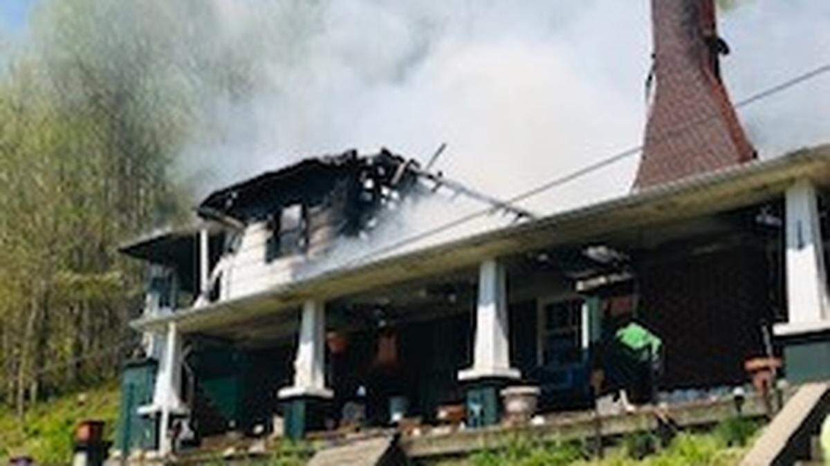 A married Harlan County couple was flown to a hospital with life-threatening injuries and two young children were missing Monday afternoon following a fire at their home on Ky. 522 in the Totz community.