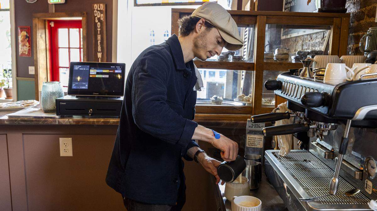 Henry Zahn prepares a coffee drink at his new coffee shop and lounge, Serendipity Public House, Wednesday, May 6, 2026 in Midway, Ky. Zahn, the son of actor Steve Zahn, opened the downtown shop after more than a year of renovations.
