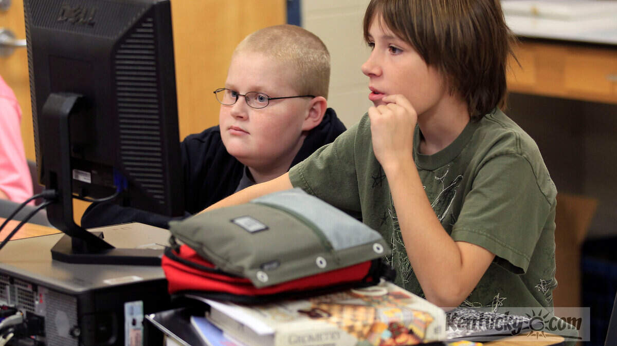 In this 2012 file photo, Zach Ehlert, left, and Iain Cavins worked on a climate change project in Patrick Goff's 8th grade integrated science class at Beaumont Middle School in Lexington. Photo by Charles Bertram | Staff