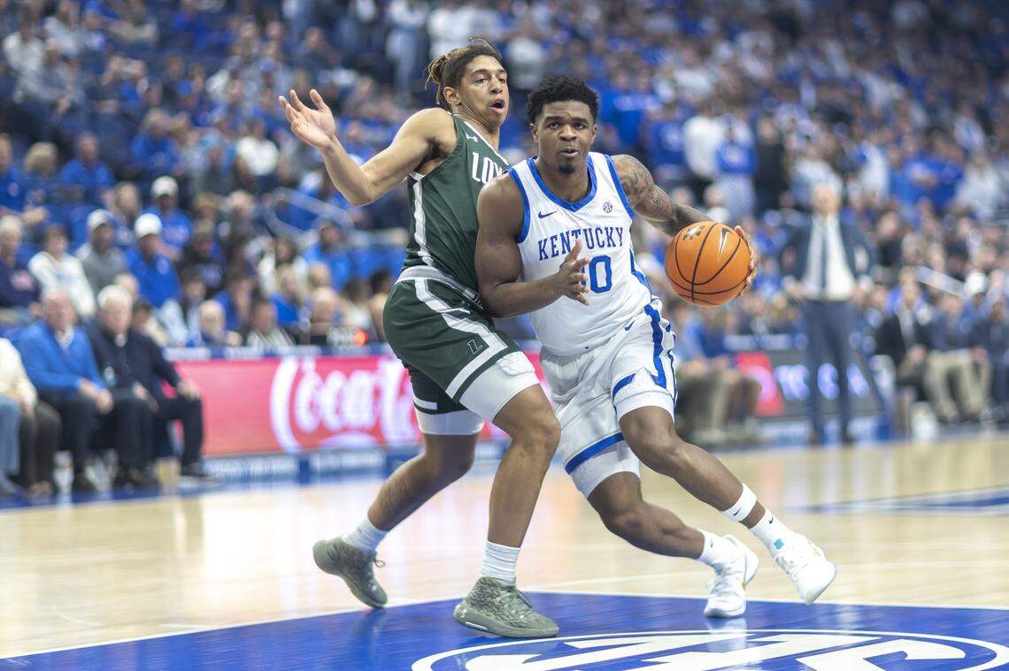 Kentucky guard Otega Oweh (00) drives the ball past Loyola (Maryland) guard Jordan Stiemke (3) during Friday’s game at Rupp Arena.