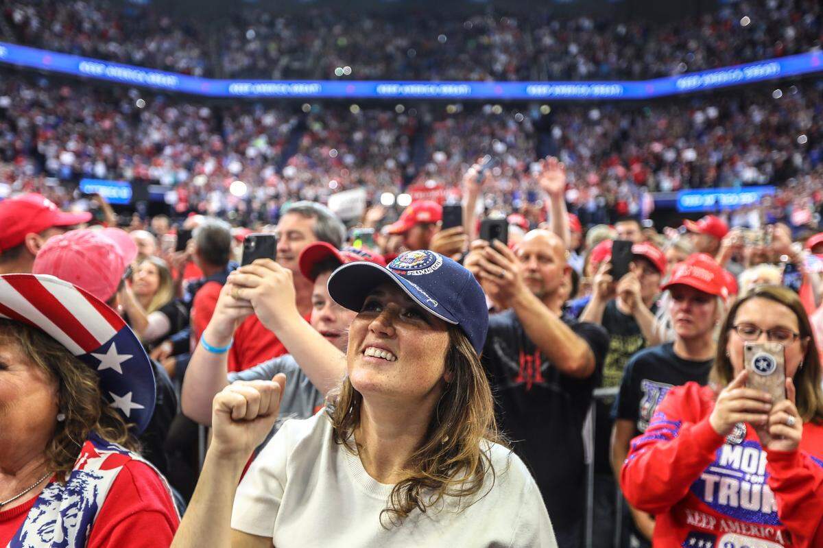 Trump supporters take photos and cheer during the Rupp Arena rally on Monday, November 4.