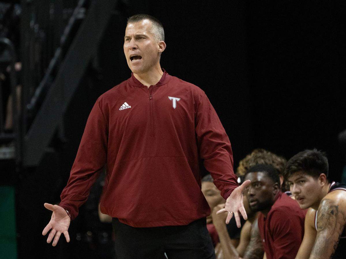 Troy coach Scott Cross calls to his team during a game against Oregon at Matthew Knight Arena in Eugene on Nov. 17, 2024.