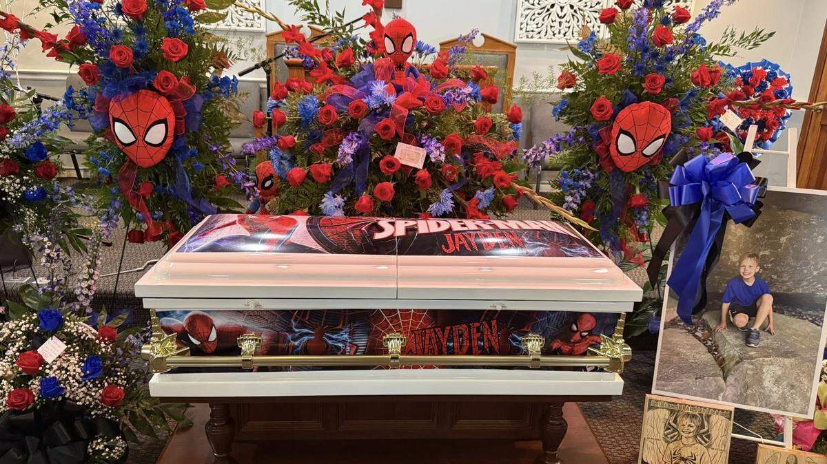 A custom, Spider-Man-themed casket and flower arrangement for 10-year-old Jayden Spicer on Thursday, Aug. 21, 2025. Jayden was found dead Aug. 12, and his mother and stepfather have been charged.