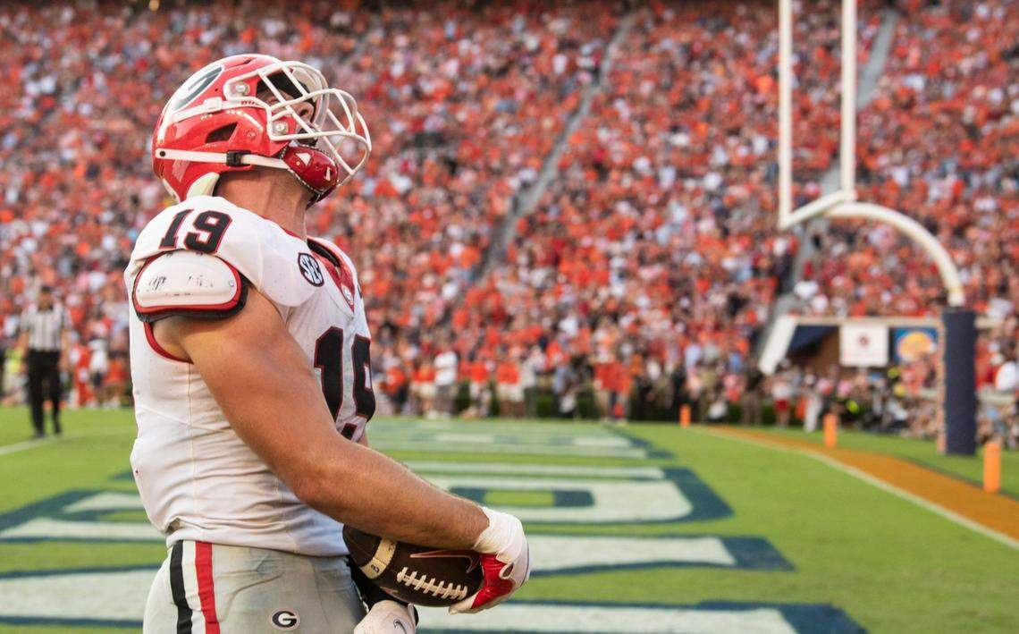Georgia tight end Brock Bowers celebrates his game-sealing touchdown catch against Auburn. He had eight receptions for 157 yards in the Tigers’ win.