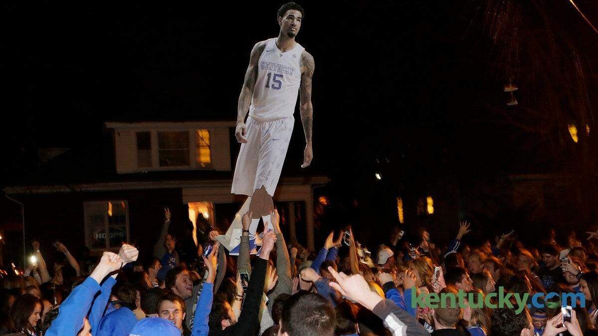 A large cardboard cutout of Kentucky star Willie Cauley-Stein was carried around over the crowd Saturday night on State Street after Kentucky's victory over Notre Dame. 