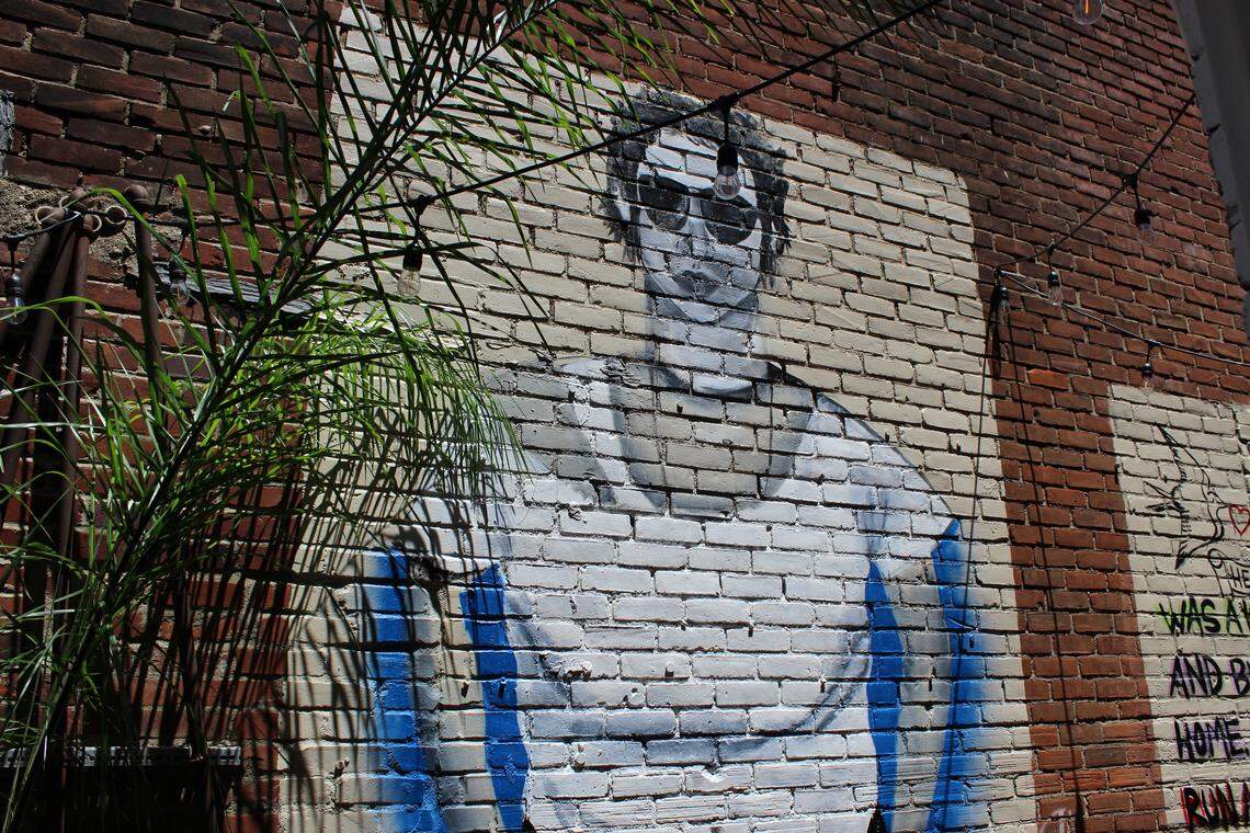 The middle portrait of Richard Hell that stands outside J. Gumbo’s restaurant. This portion of the three part mural was largely painted by Montessori High School student Caileigh Kolasa.