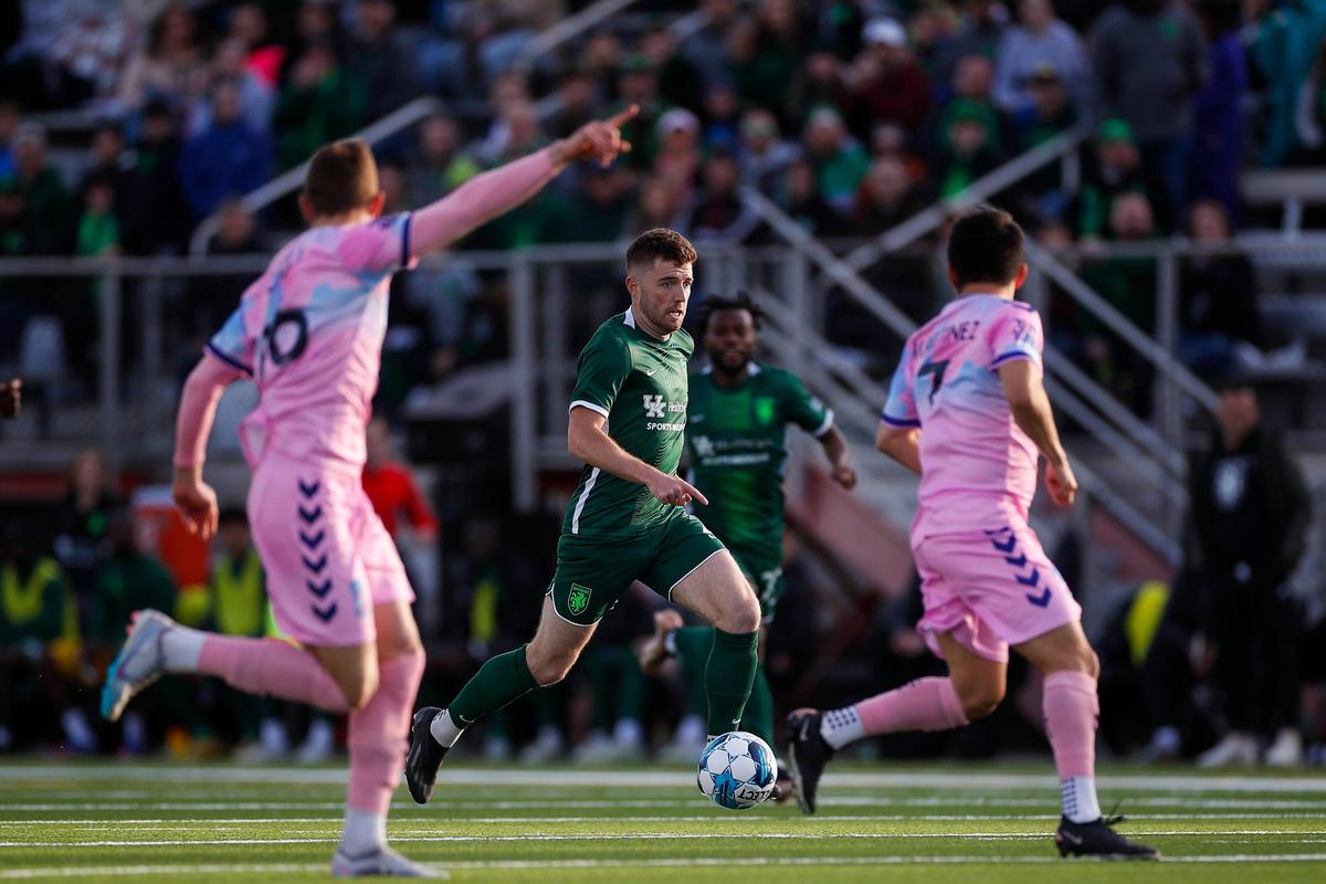 Lexington Sporting Club’s Tate Robertson (2) moves the ball up the pitch during LSC’s first-ever home match against Forward Madison FC at Toyota Stadium in Georgetown on April 8.