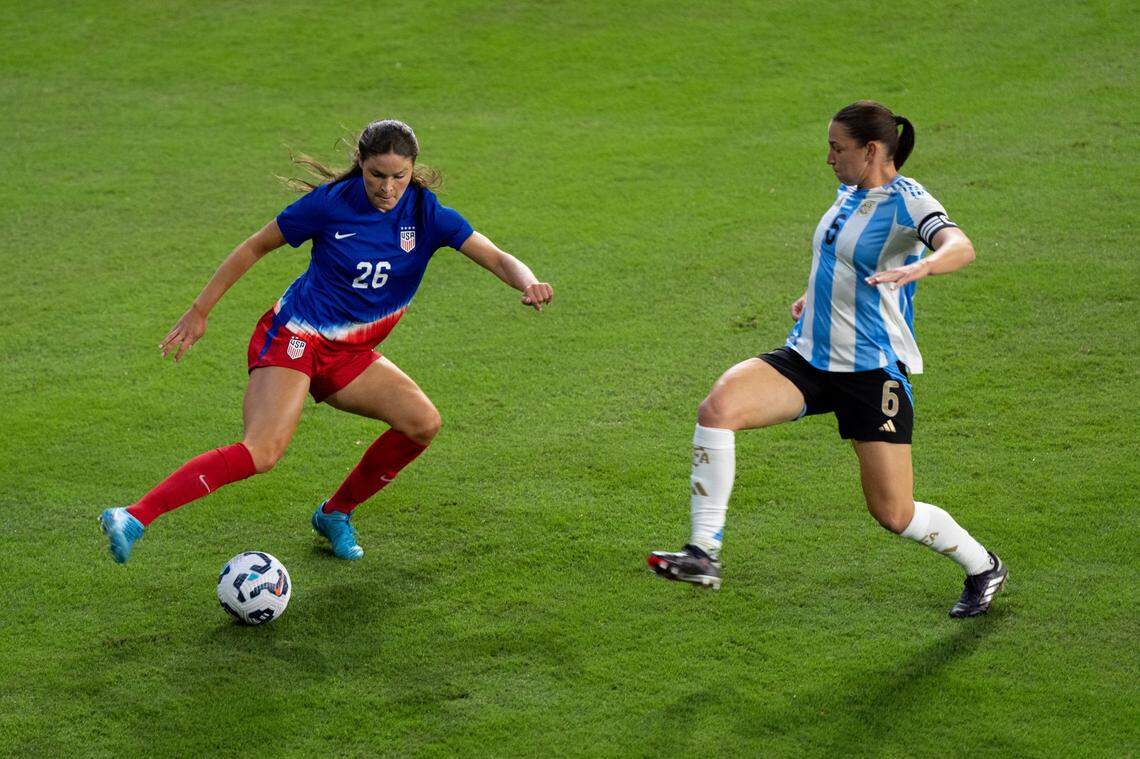Emma Sears (26) takes on Argentina’s Aldana Cometti at Lynn Family Stadium in Louisville on Wednesday night. Sears, who plays for Racing Louisville in the National Women’s Soccer League, was making her first start for the United States.