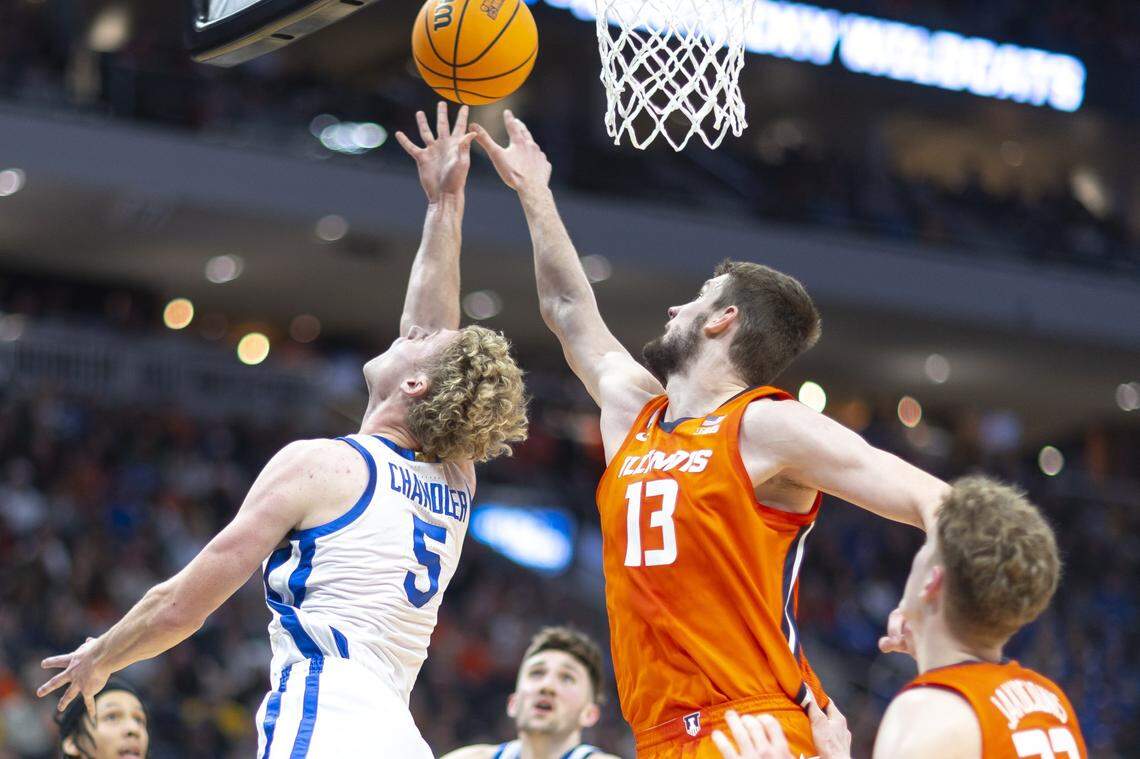 Illinois center Tomislav Ivisic (13) blocks a shot by Kentucky guard Collin Chandler (5) during a second-round NCAA Tournament game at Fiserv Forum in Milwaukee on Sunday.