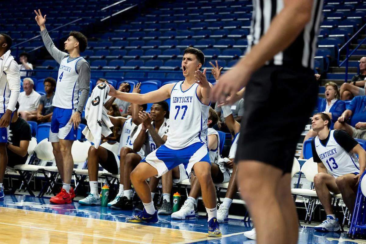 Kentucky basketball newcomer Kerr Kriisa celebrates from the bench during the team’s practice against La Familia, a squad of former Wildcats, last week in Rupp Arena.